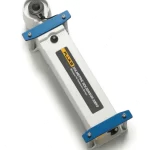 White rectangular sensor/probe device with blue end brackets and a Fluke label, shown at an angle with circular connectors on both ends, used for calibration or testing workflows.